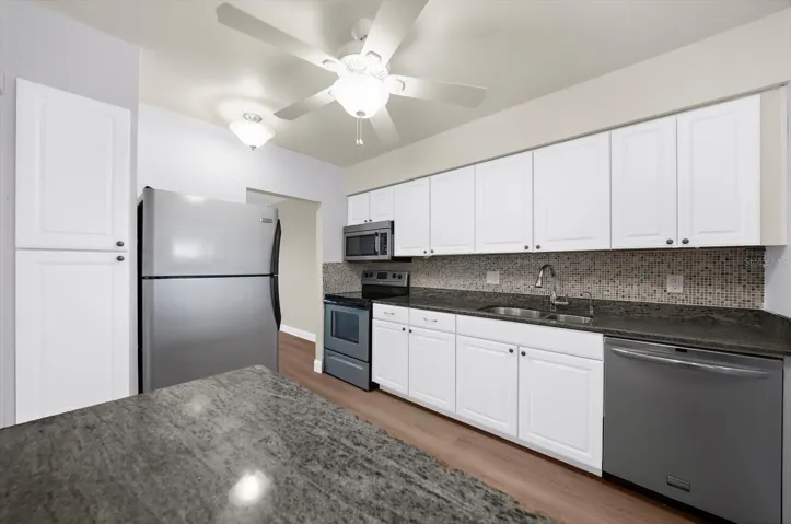 Another view of the kitchen showing the large pantry