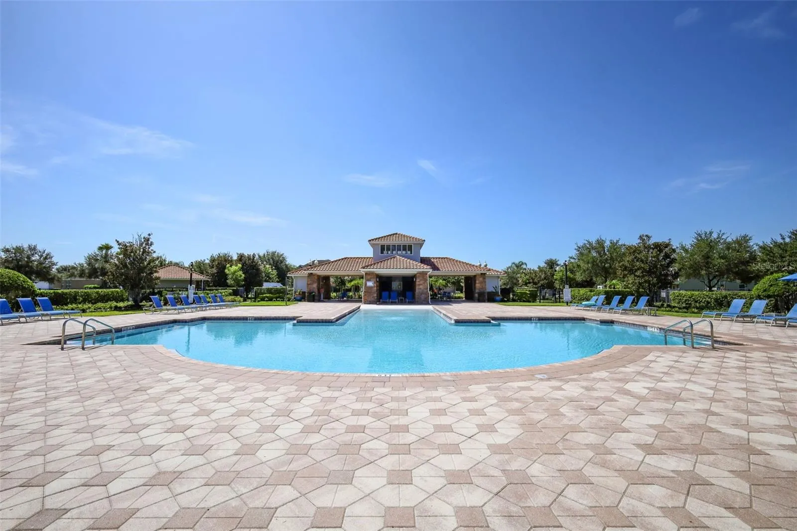 Scenic view of the sparkling pool and patio area, perfect for relaxing