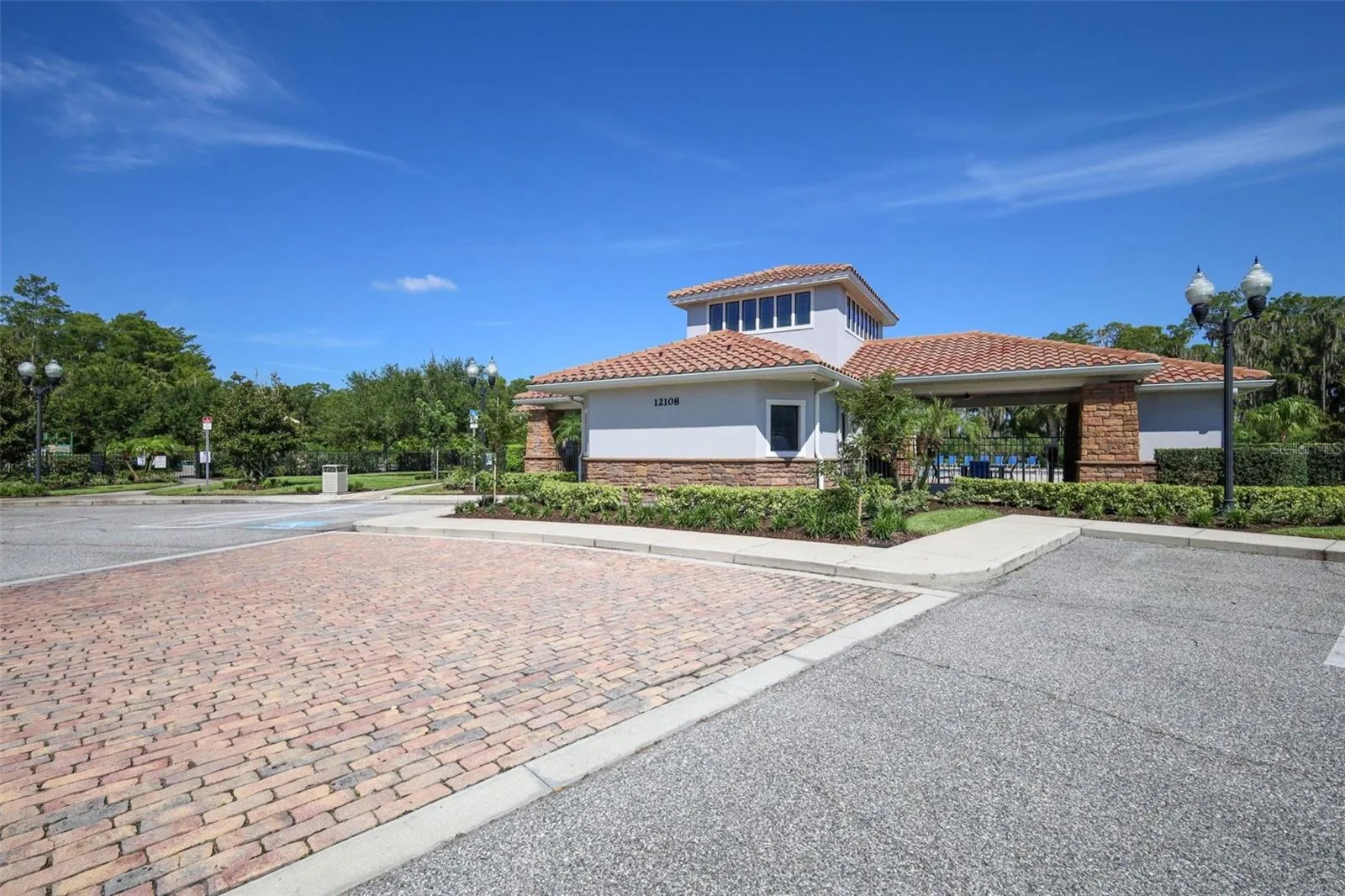 Clubhouse, pool area, and parking spaces.