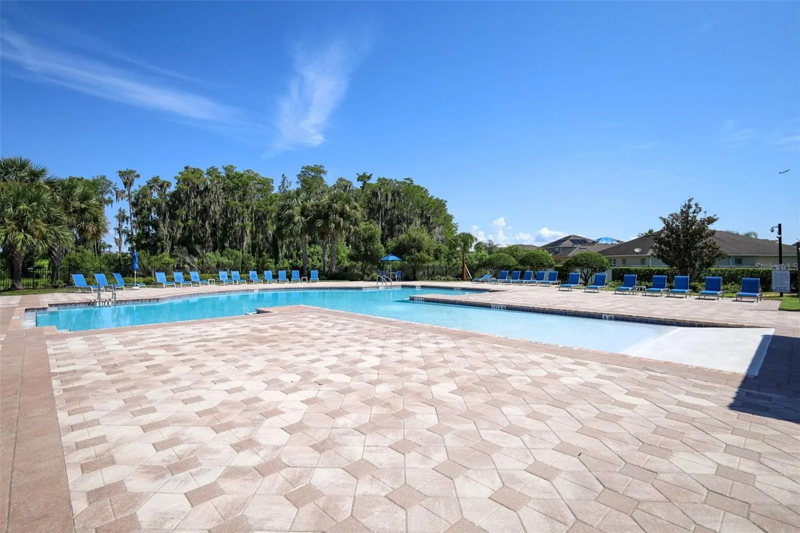 Scenic view of the sparkling pool and patio area, perfect for relaxing