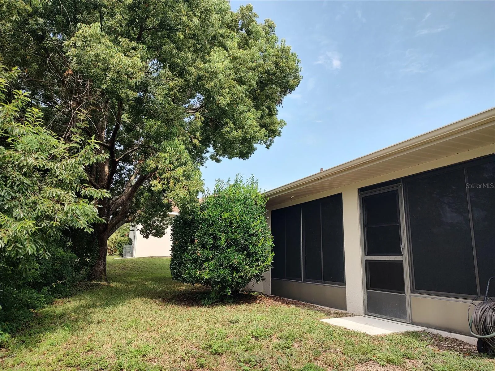 Screened porch opens to back yard (vinyl windows