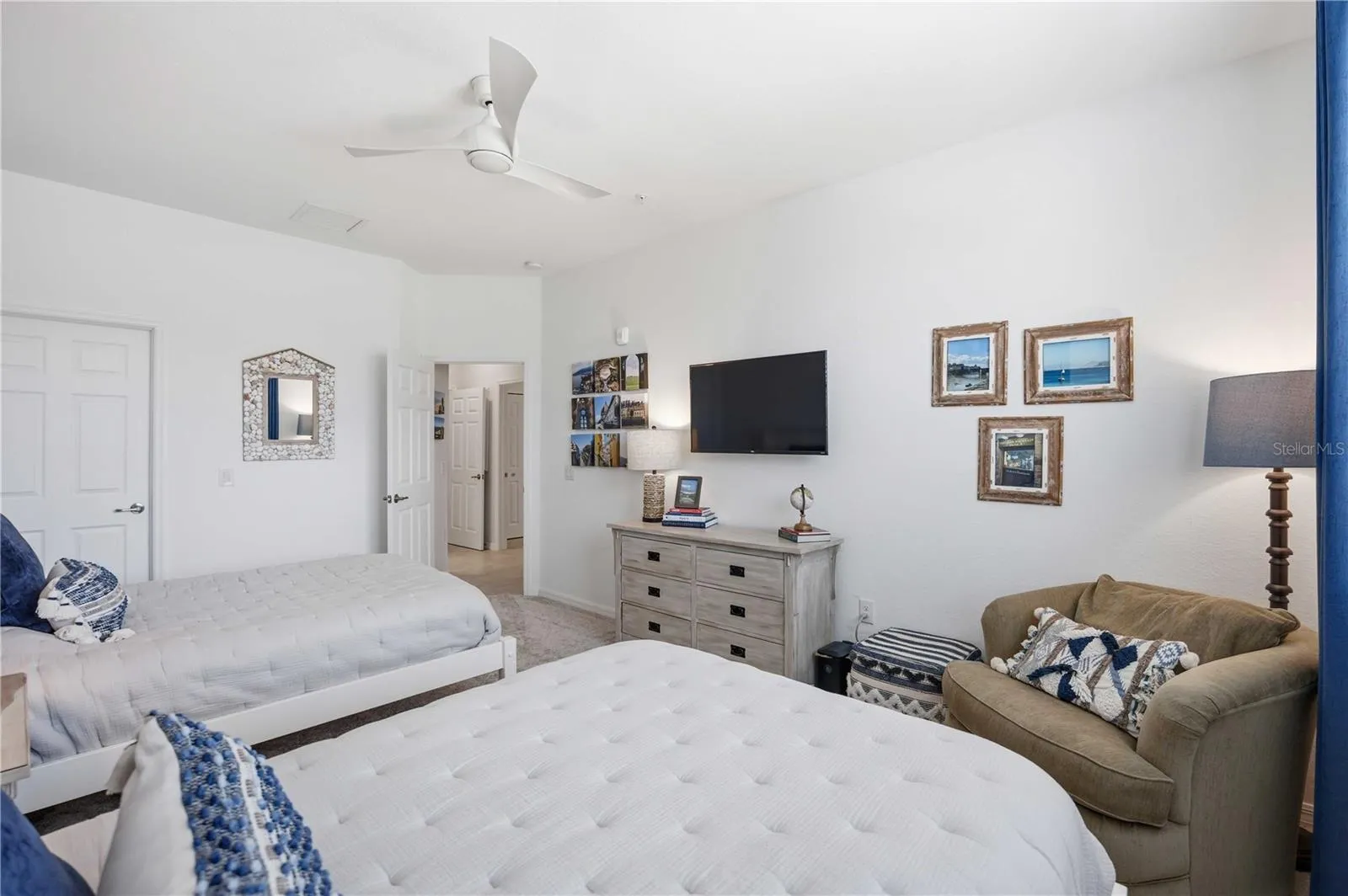 Guest room 3 has two full beds for guests. There is ample room to move around.