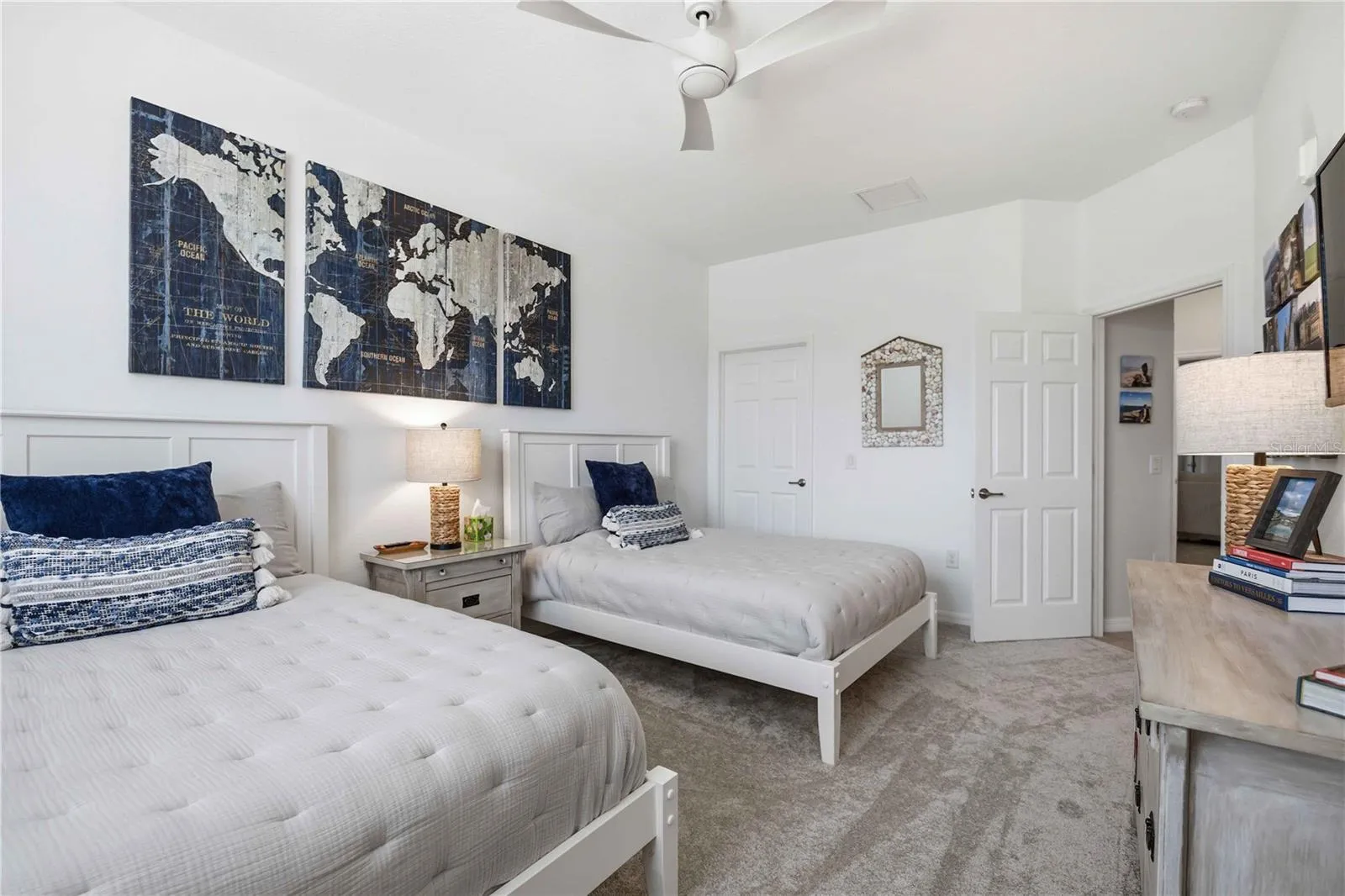 Guest room 3 has two full beds for guests. There is ample room to move around.