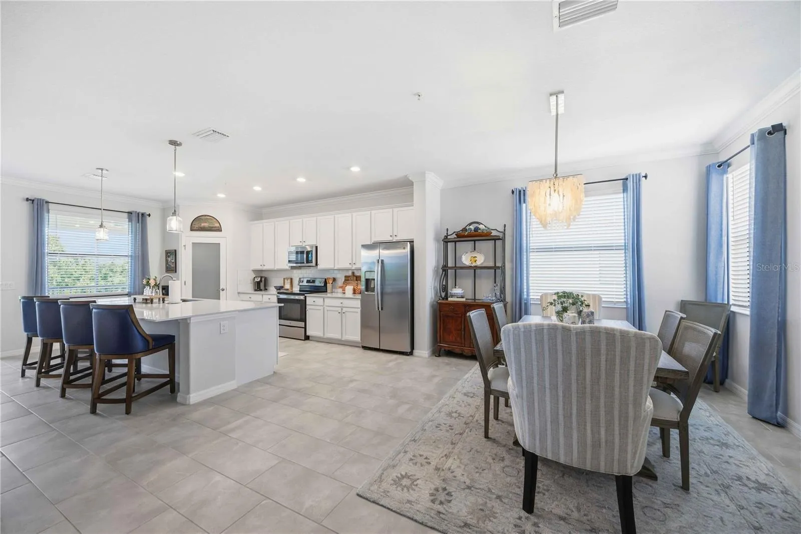 The dining room is set for six but can easily be set for more.