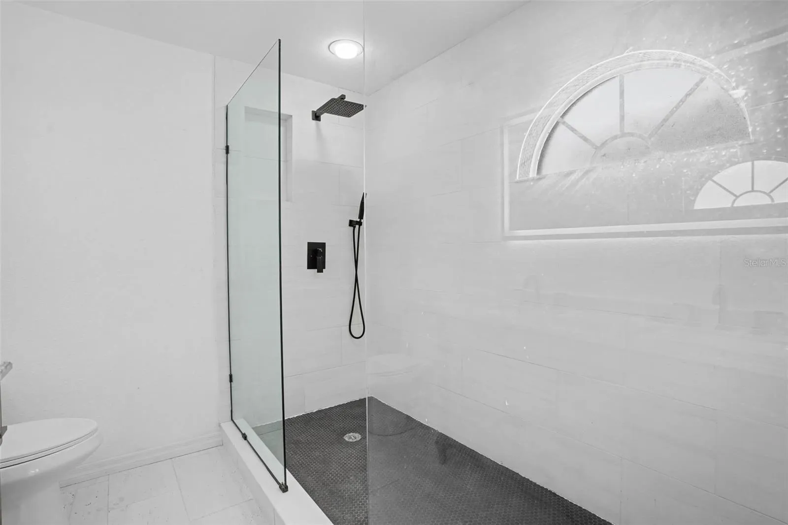 Beautiful Glass With Tiled Floor and Wall