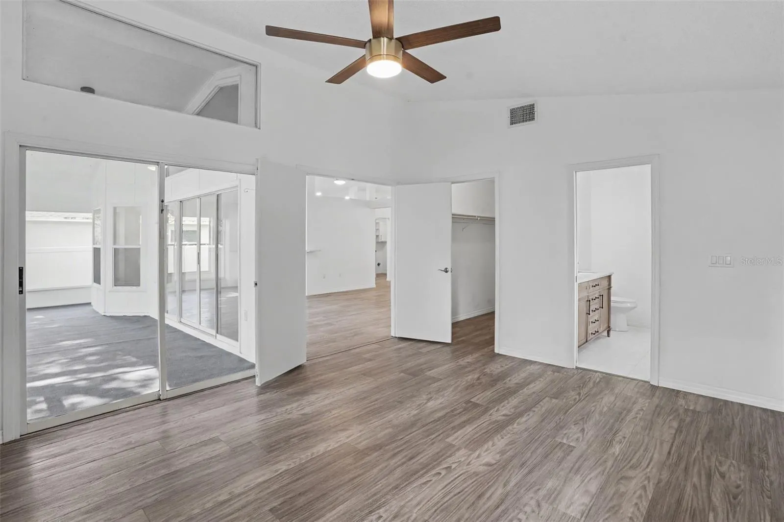 Primary Bedroom Toward Porch and Living Room