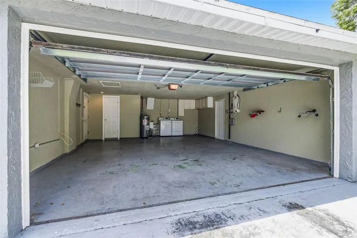 Over sized 2 car garage with laundry, storage and secondary bathroom
