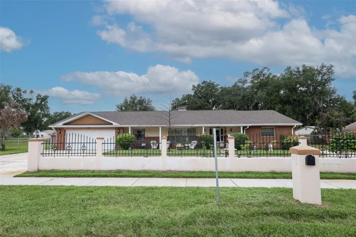 Front with circular driveway.