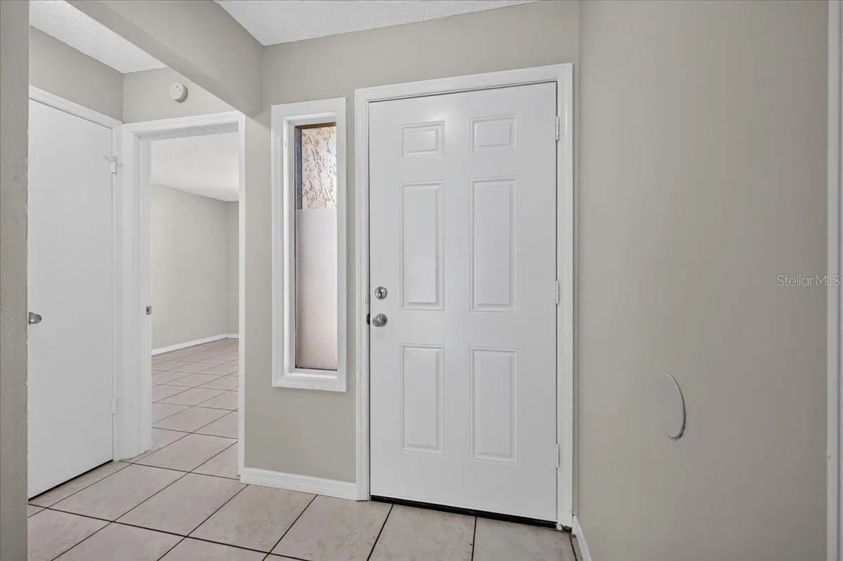 Looking at front door and bedroom from inside