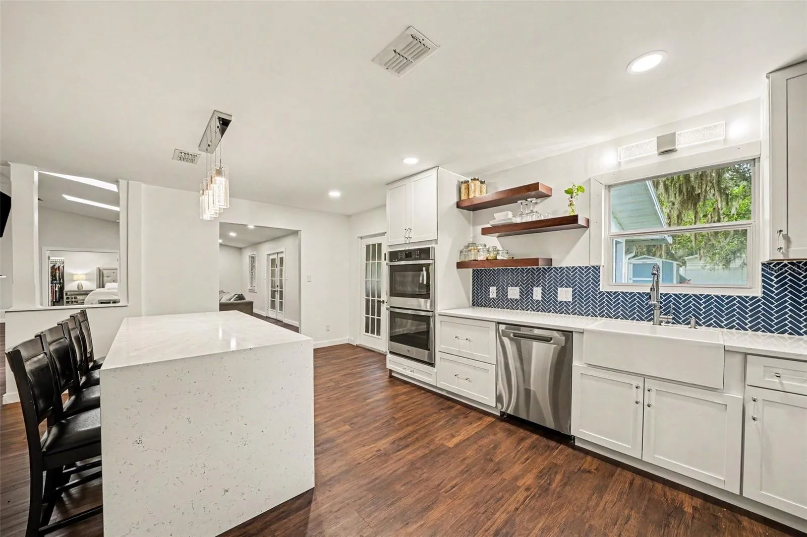 Gorgeous Kitchen with decorative blue tile backsplash & double Oven