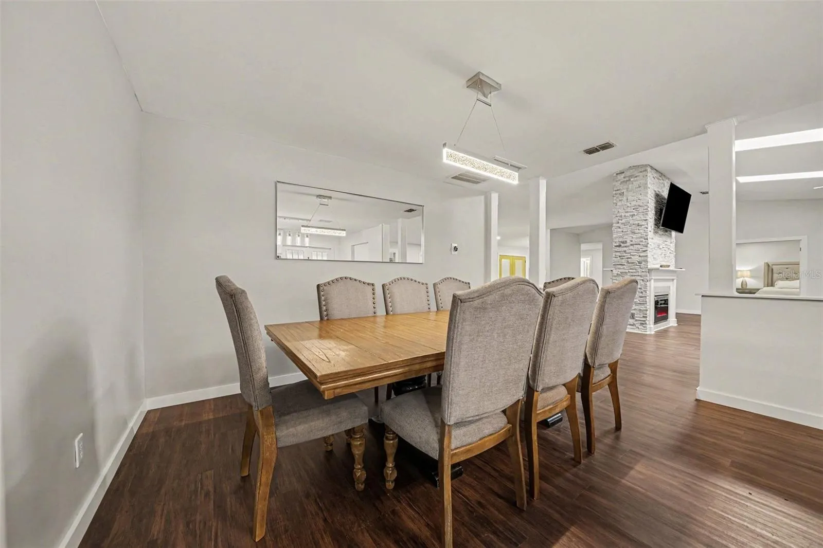 Dining Area accented by columns w/seating for 8