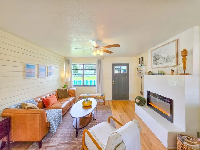 Electric fireplace and shiplap accent wall.
