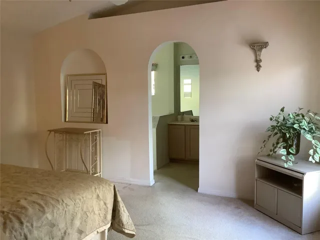 Primary bedroom with primary bathroom entry