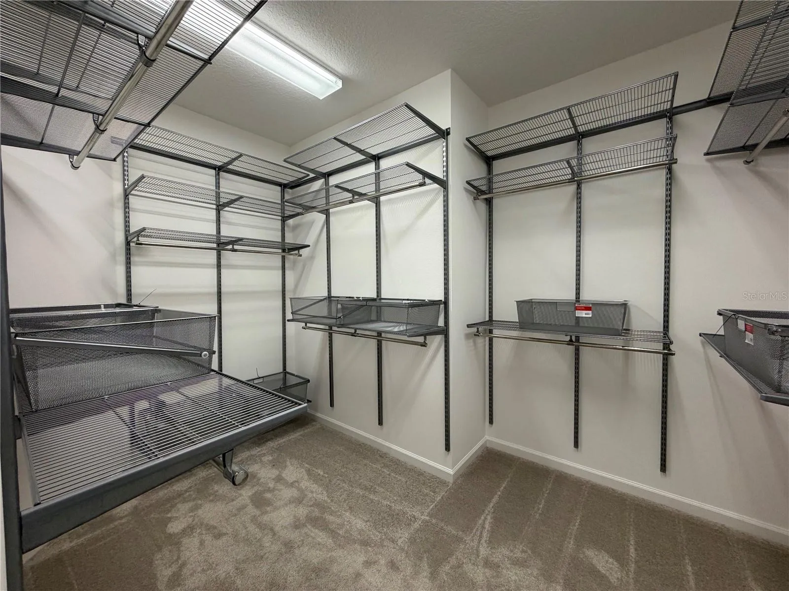 Primary bedroom walk in closet