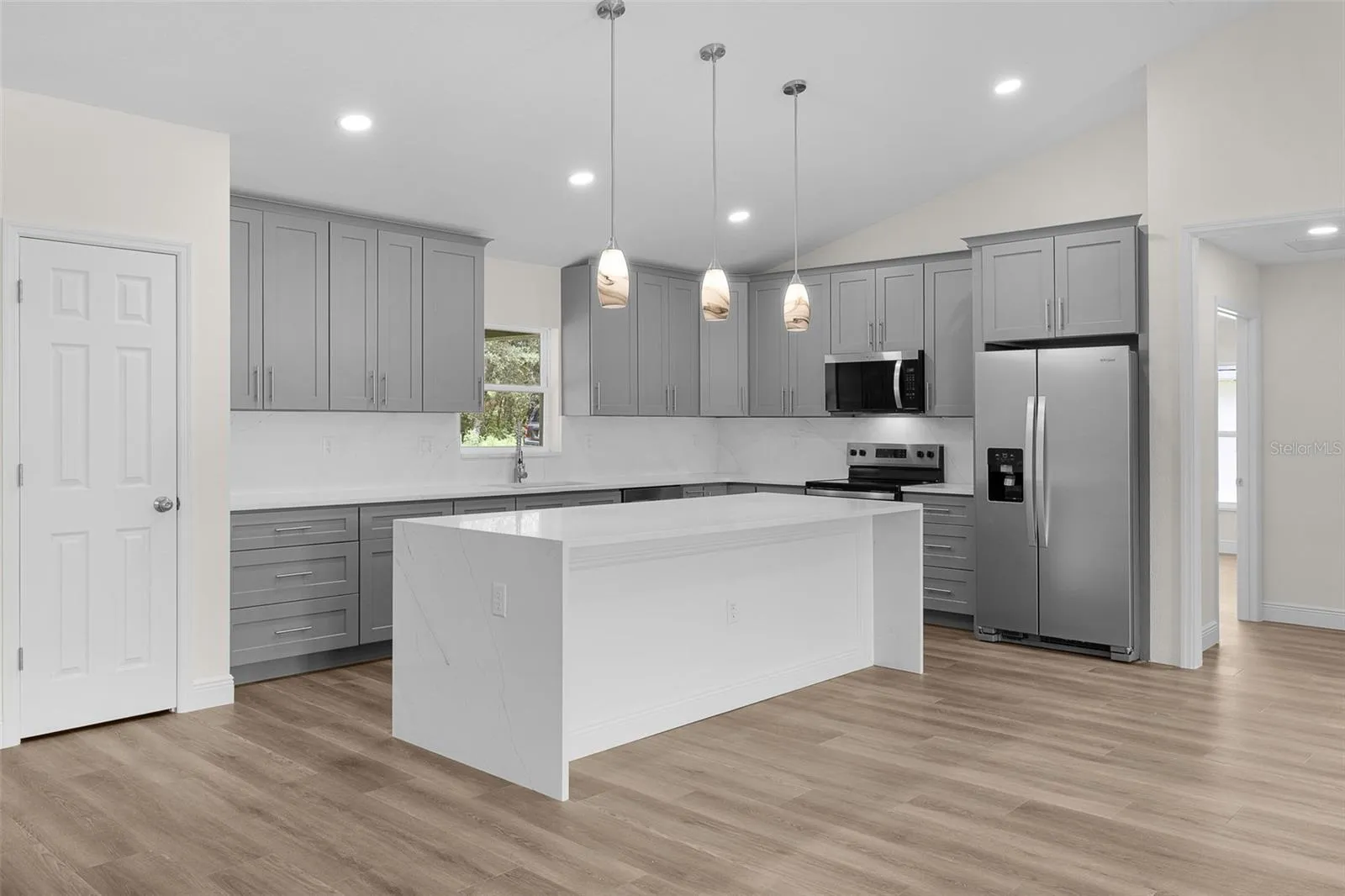 Quartz countertops with Island having the quartz "Waterfall"
