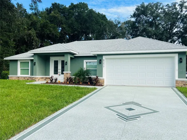 Check out all the extras on this exterior! Concrete design, Huge floating house numbers, real rock accent &amp; nice landscaping.