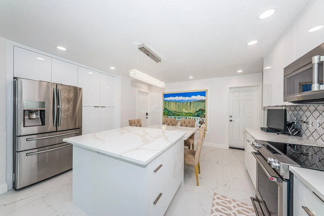 Beautiful quartz island with deep soft close drawers and charging outlets