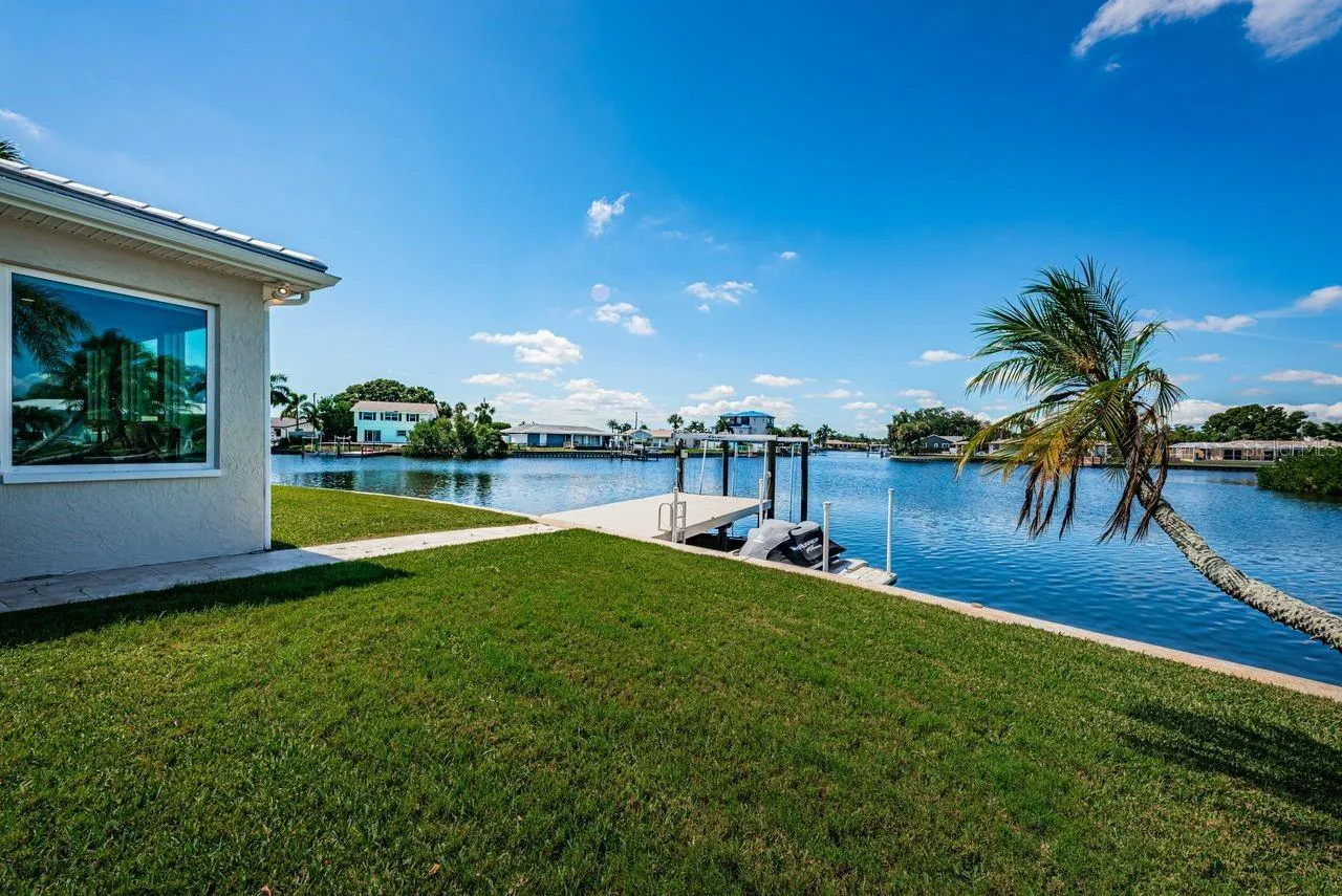 Beautiful wide open water view with dock, hefty boat lift and floating dock