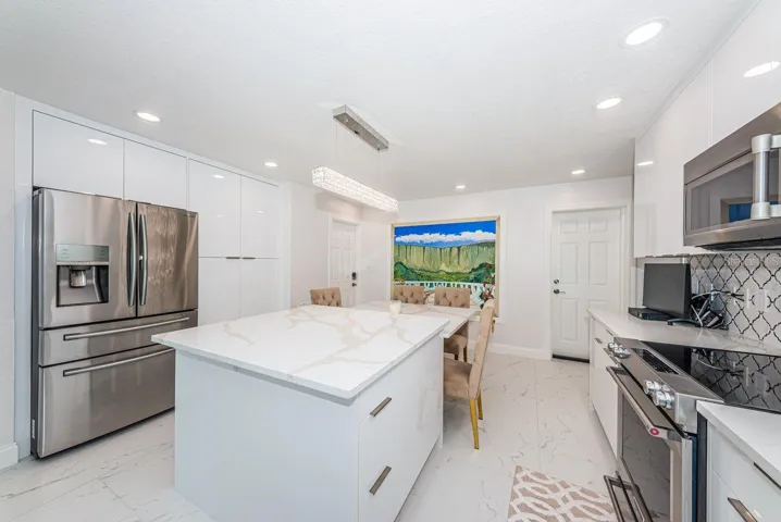 Beautiful quartz island with deep soft close drawers and charging outlets