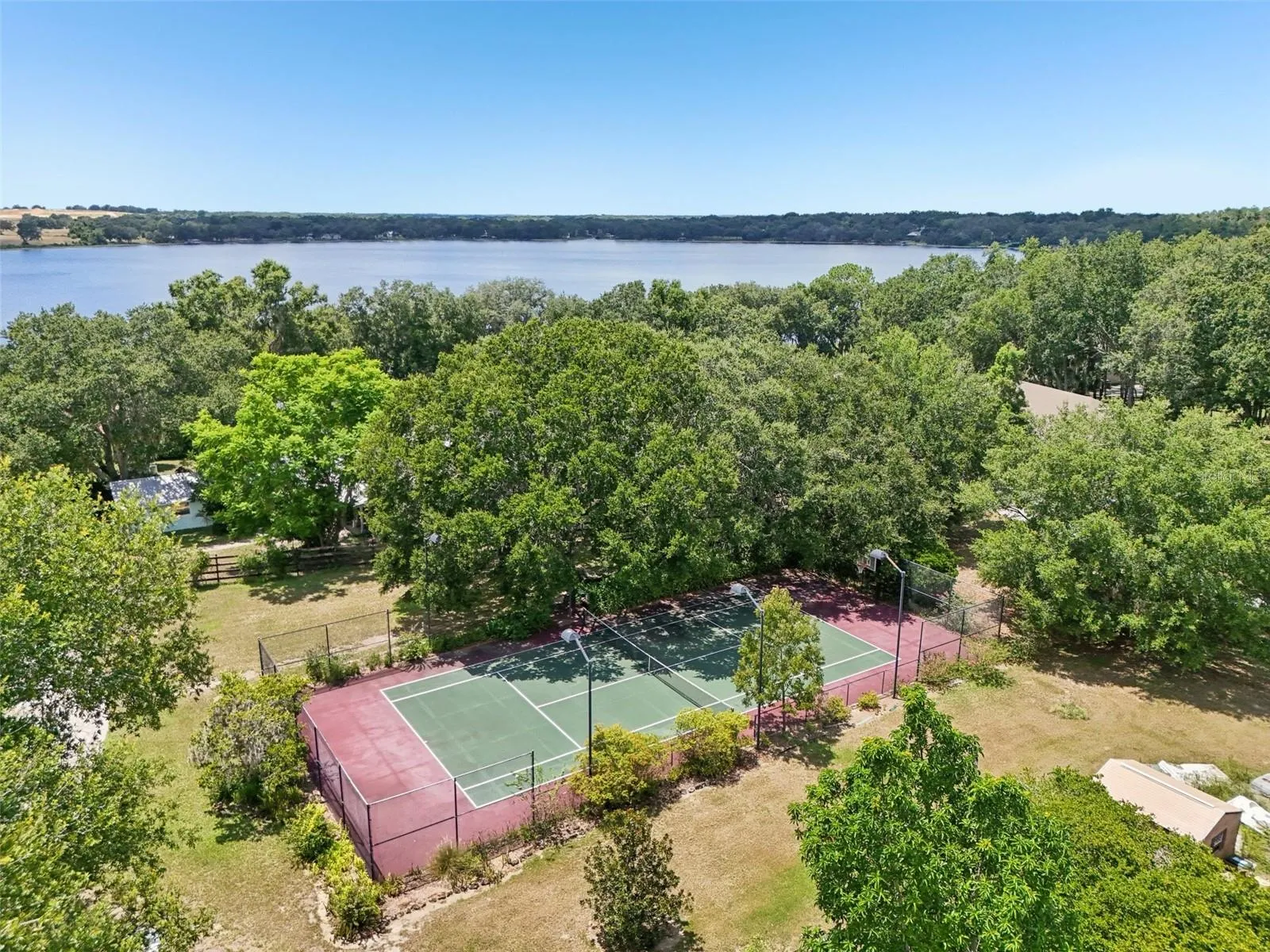 Regulation sports court is lighted &amp; fenced