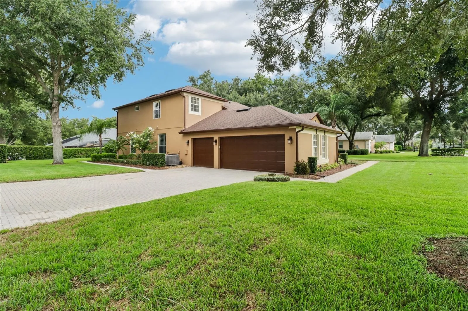 Oversized corner lot with a 3-car side facing garage.