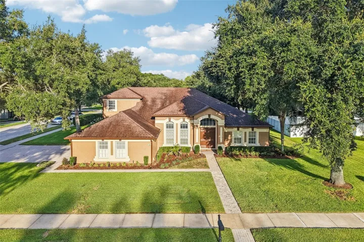 Welcome to one of Wekiva Run's most sought-after floor plans, offering exceptional space, flexibility, and timeless style on a beautifully landscaped .36 ACRE CORNER LOT!