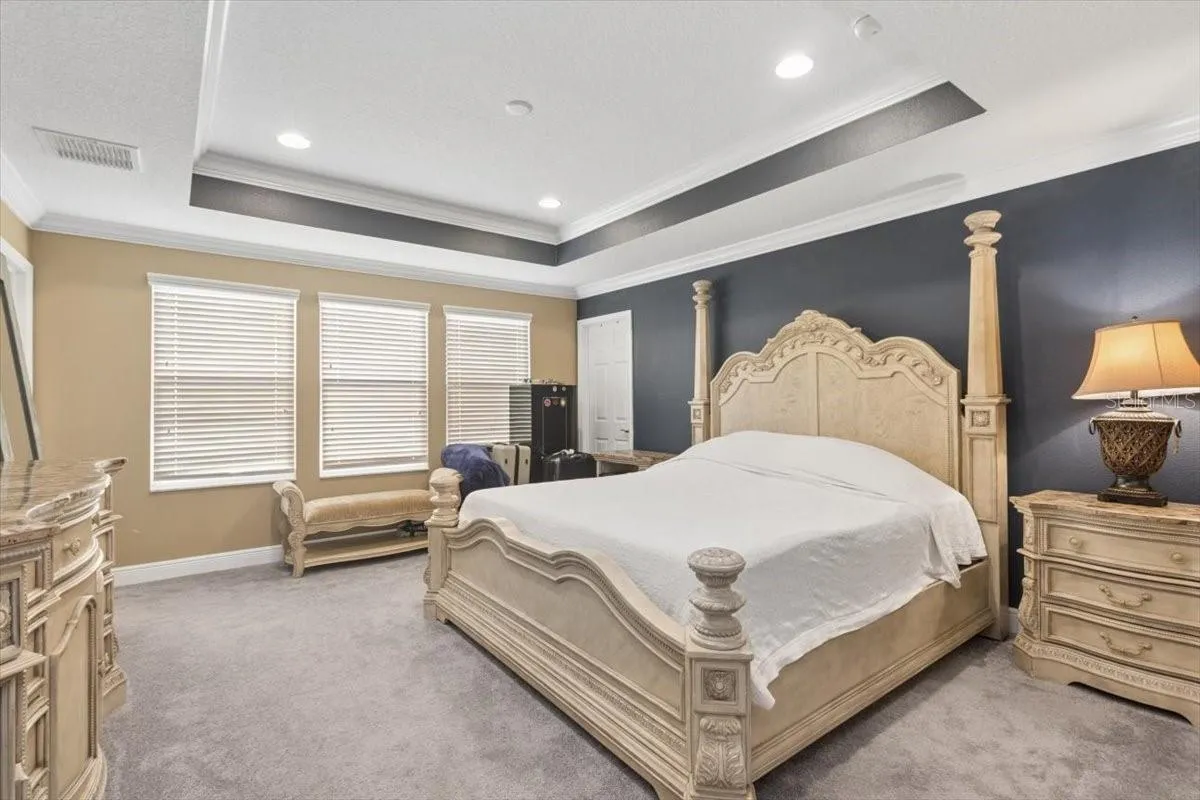 The spacious primary bedroom offers a serene and peaceful retreat, providing the perfect place to relax and unwind at the end of the day.