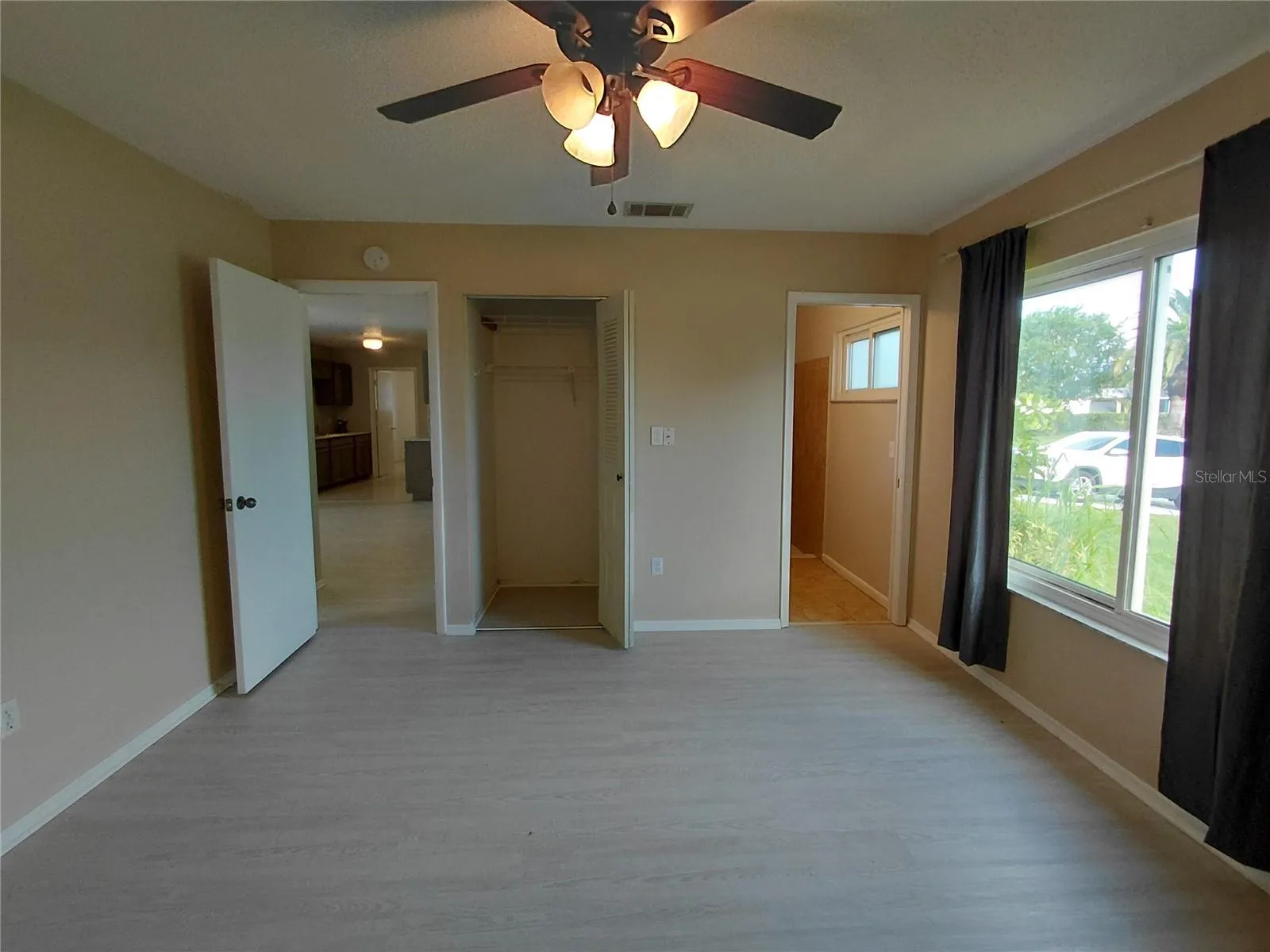 Primary Bedroom with closet and private Full Bathroom.