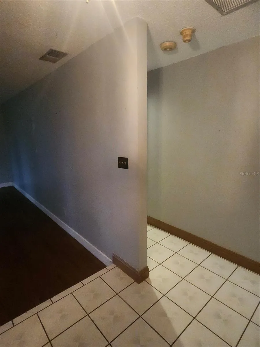 VIEW FROM FOYER TOWARDS FORMAL AND PRIMARY BEDROOM
