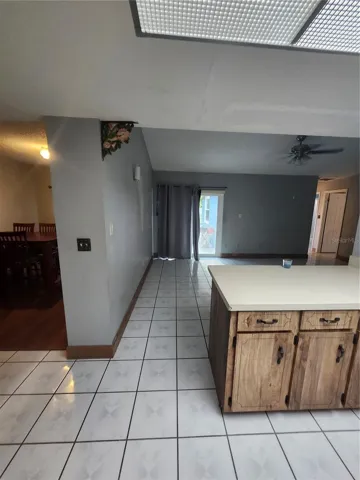 KITCHEN VIEW OF FAMILY ROOM AND FORMAL DINING ROOM
