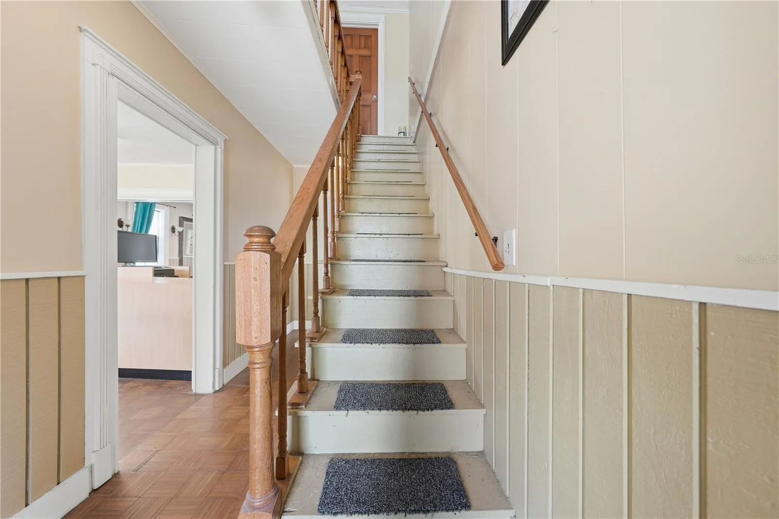 Stairs lead to a full bath and 2 additional rooms