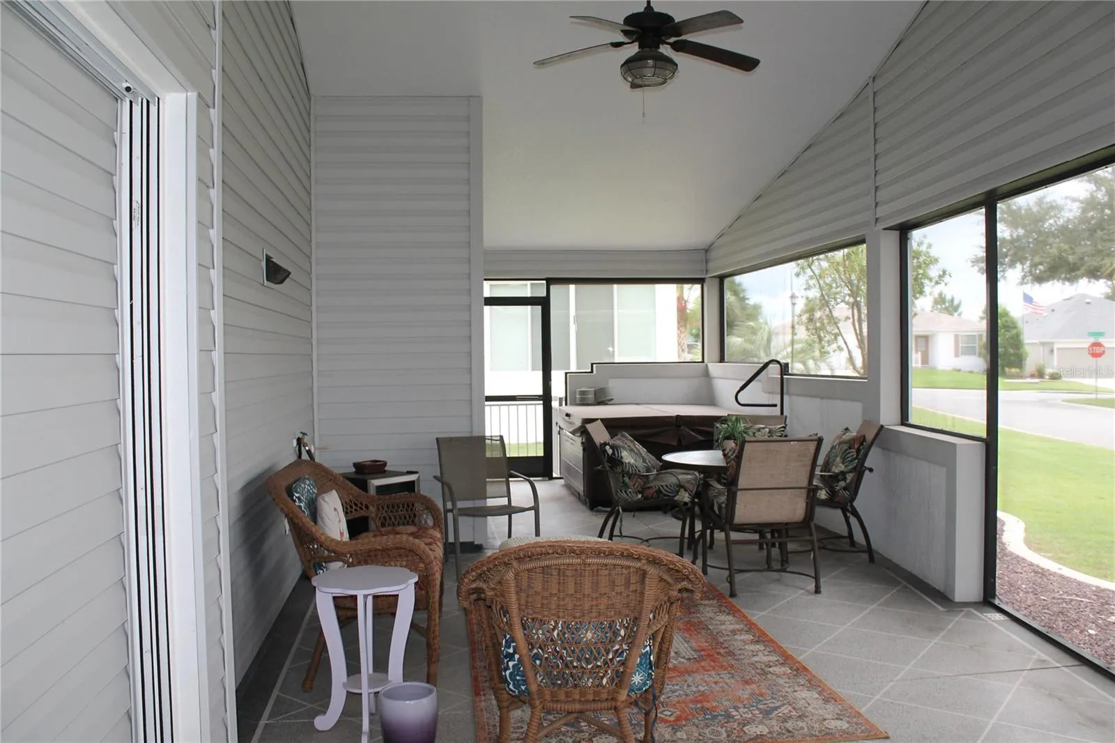 Lanai with ceiling fans and hot tub
