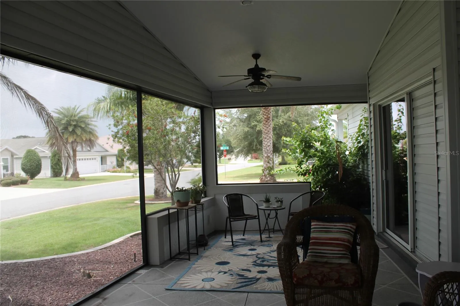 Lanai with ceiling fans and hot tub