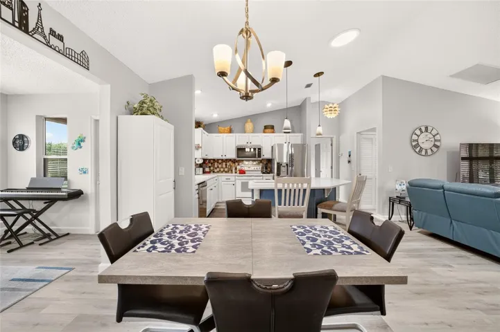 Dining area looking to kitchen