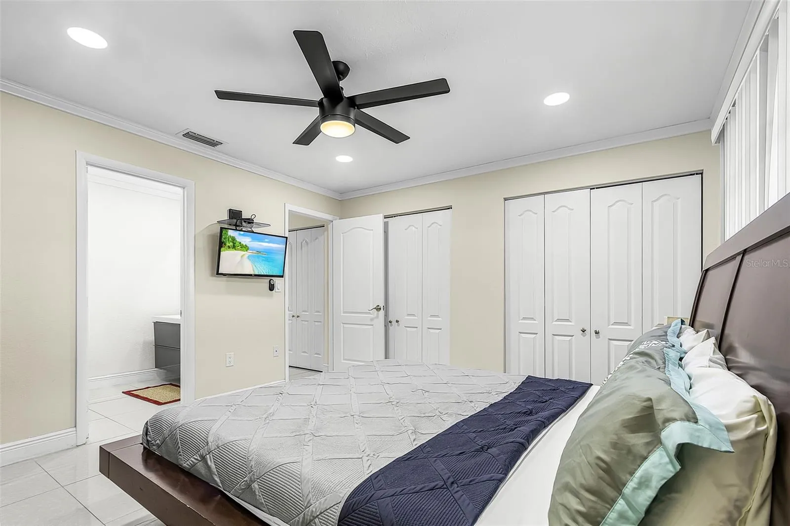 Alternate primary bedroom view showing generous closet space and private bath access.