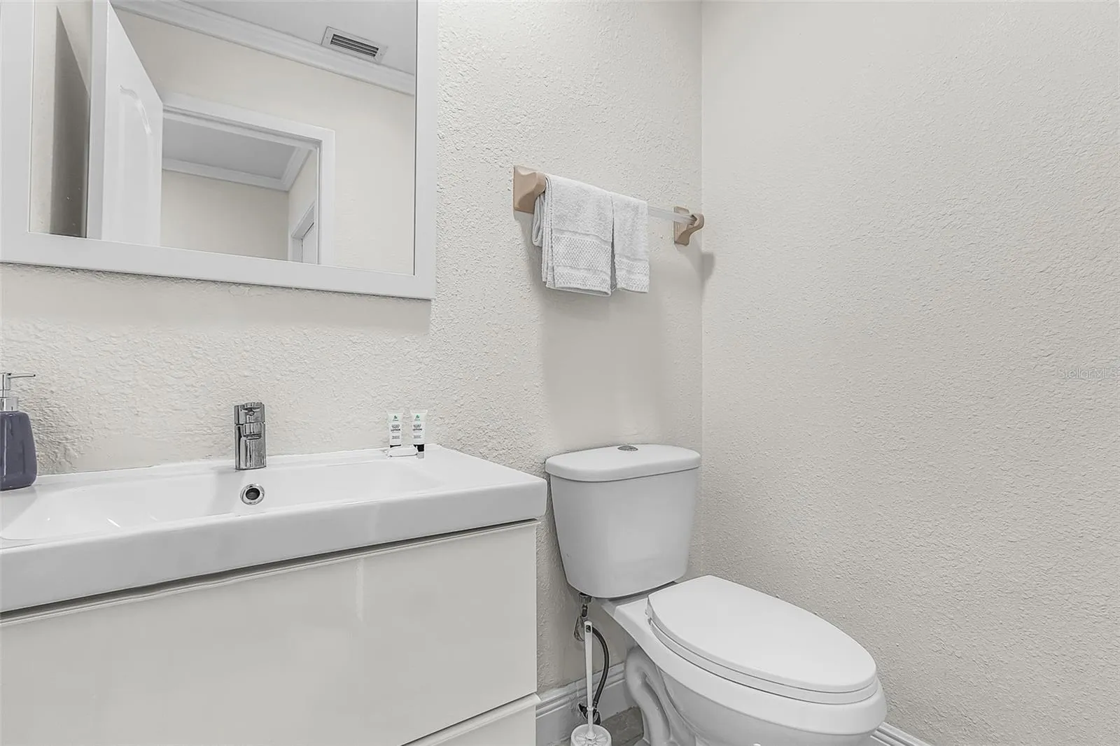Convenient half bathroom near the main living area.