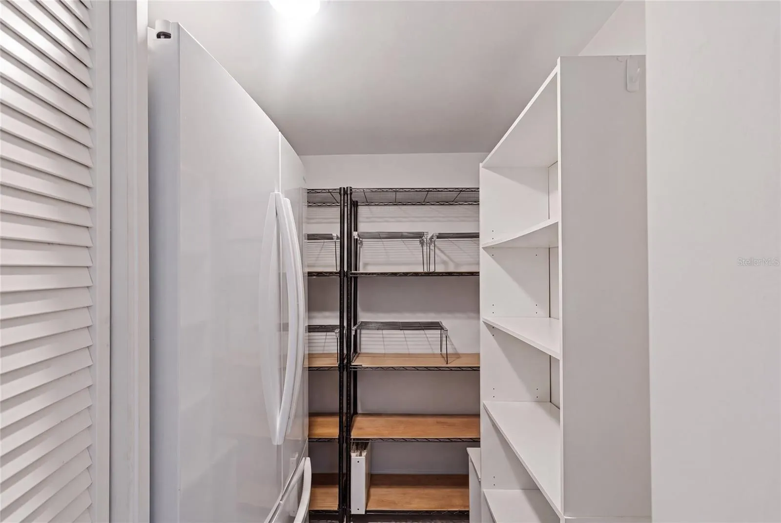 Butler's pantry with an extra fridge and storage galore!