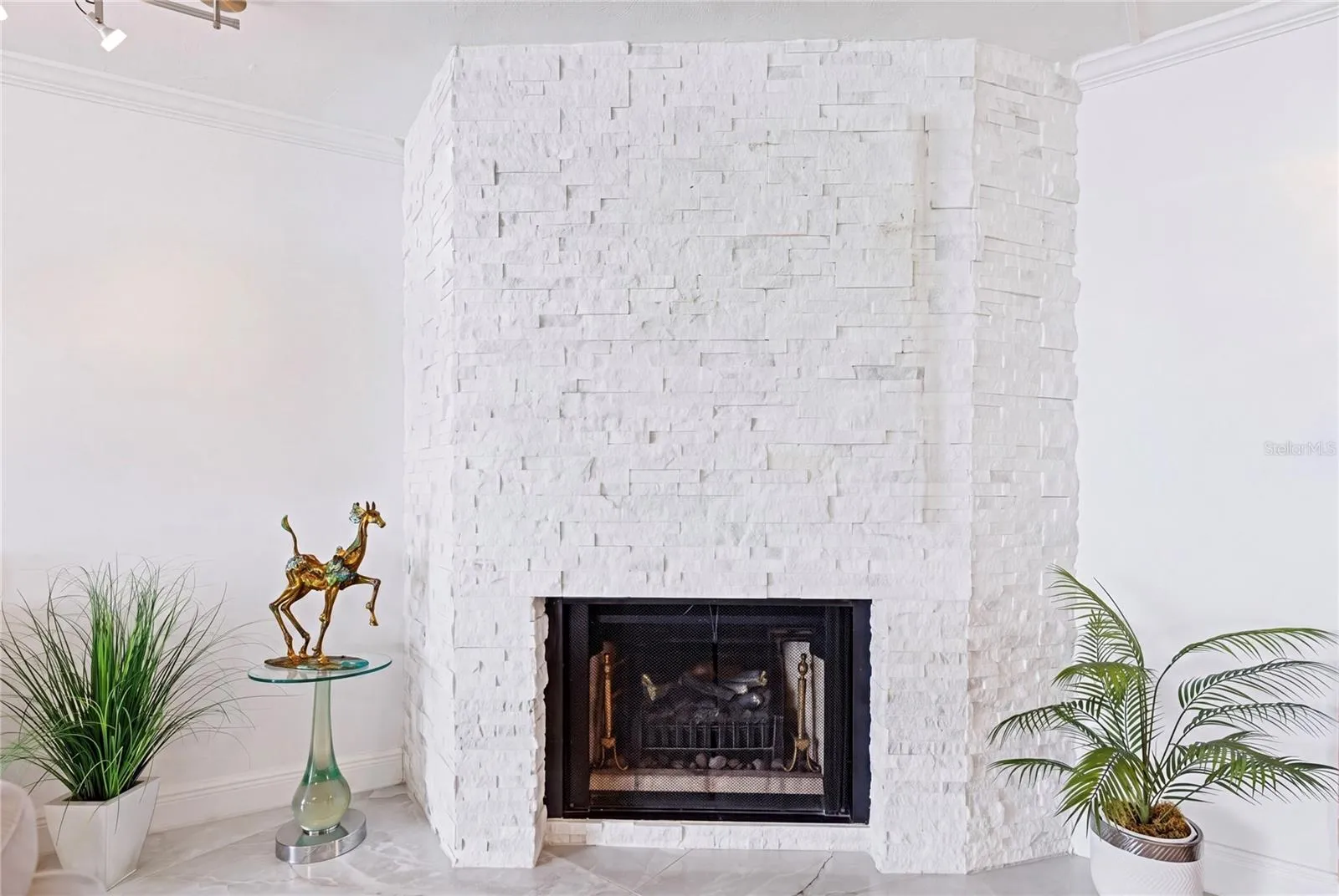 The natural stone facade flows throughout the home tying each space together in perfect harmony.