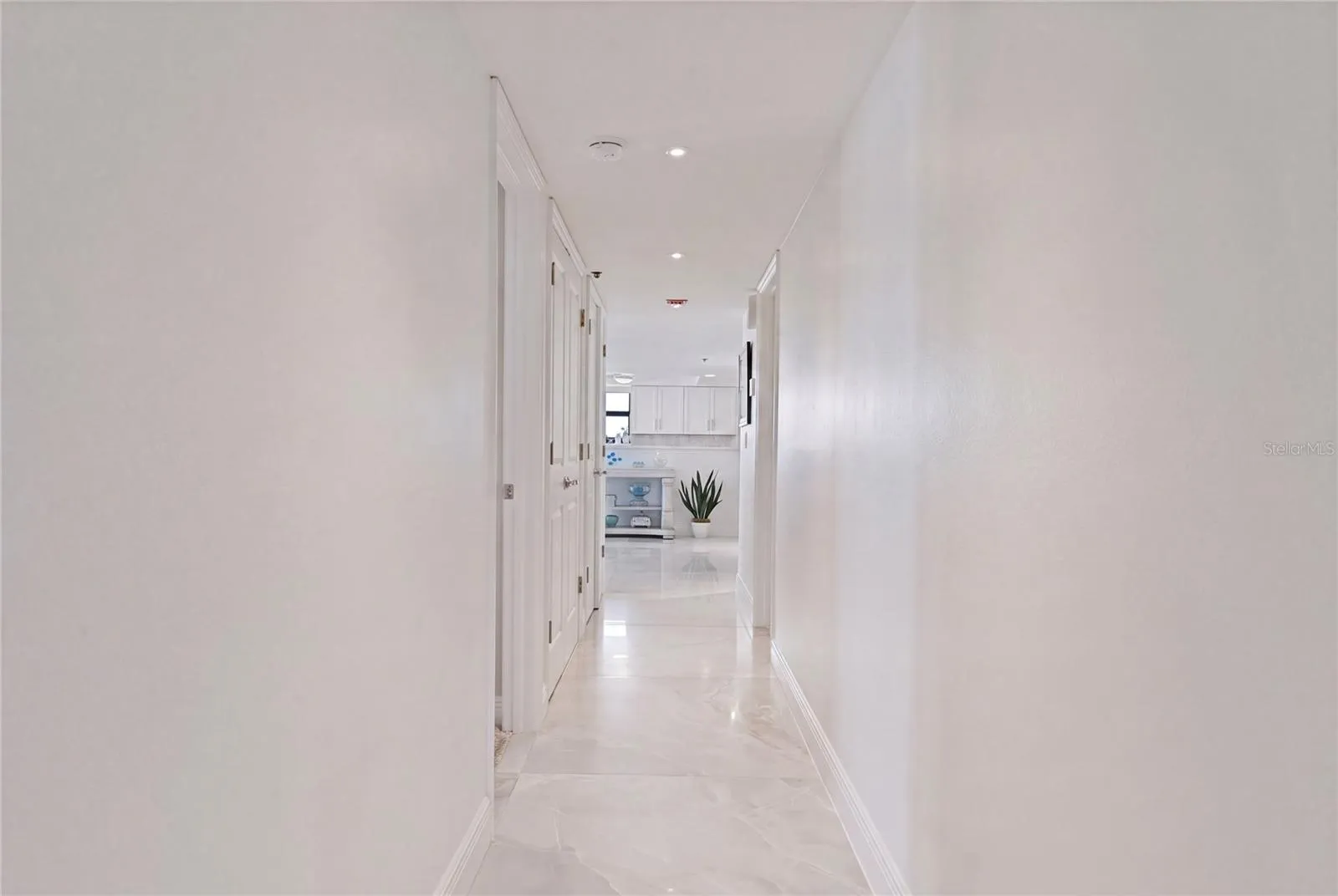 A private hallway leads to the Primary Suite.