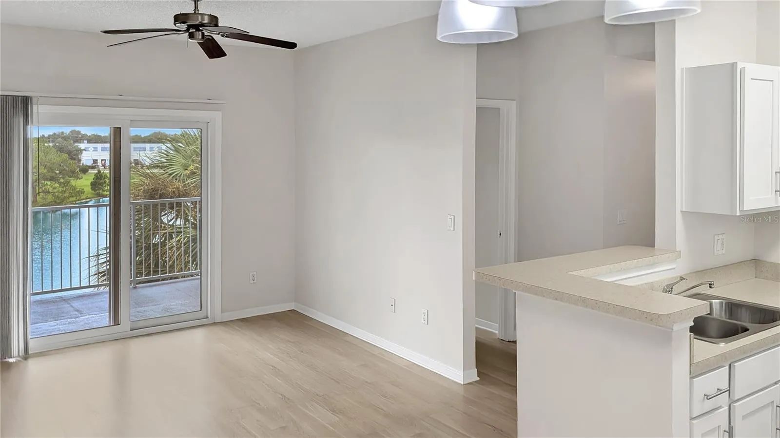 Living Room &amp; Kitchen as seen from Dining Room!  •Brand-New PAINT inside means the home even Smells New! Nice!
