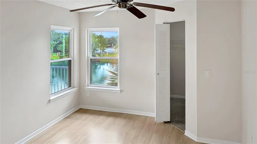 Master Bedroom showing  LAKE VIEWS and Large Walk-In Closet!