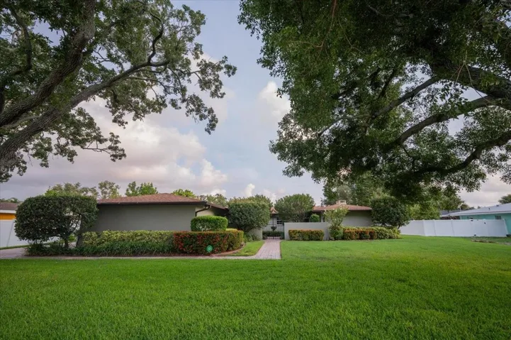 Welcome to 7605 17th Ave NW with its beautifully manicured lawn and landscape.