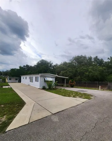 View of home and RV parking with full hook-up