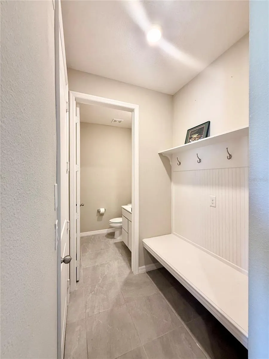 Garage Entry, Half Bath, Built-In Coat Rack