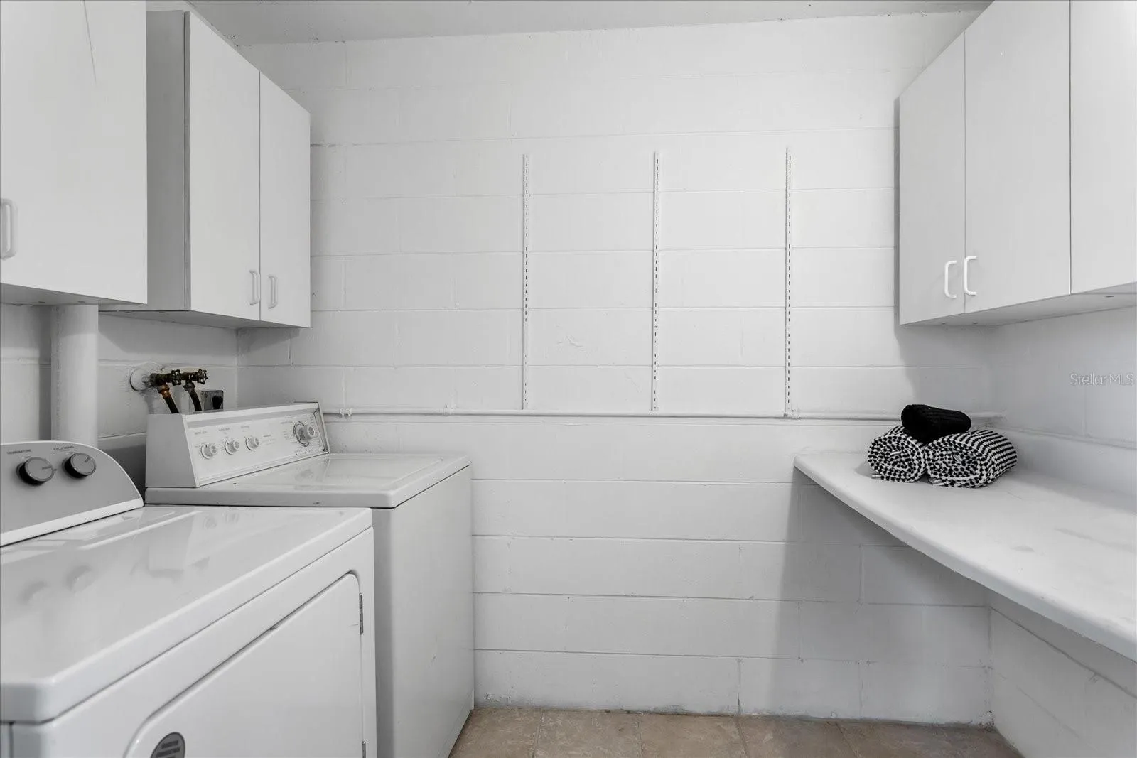 Spacious Laundry Room, Overhead Cabinets &amp; large Folding Counter