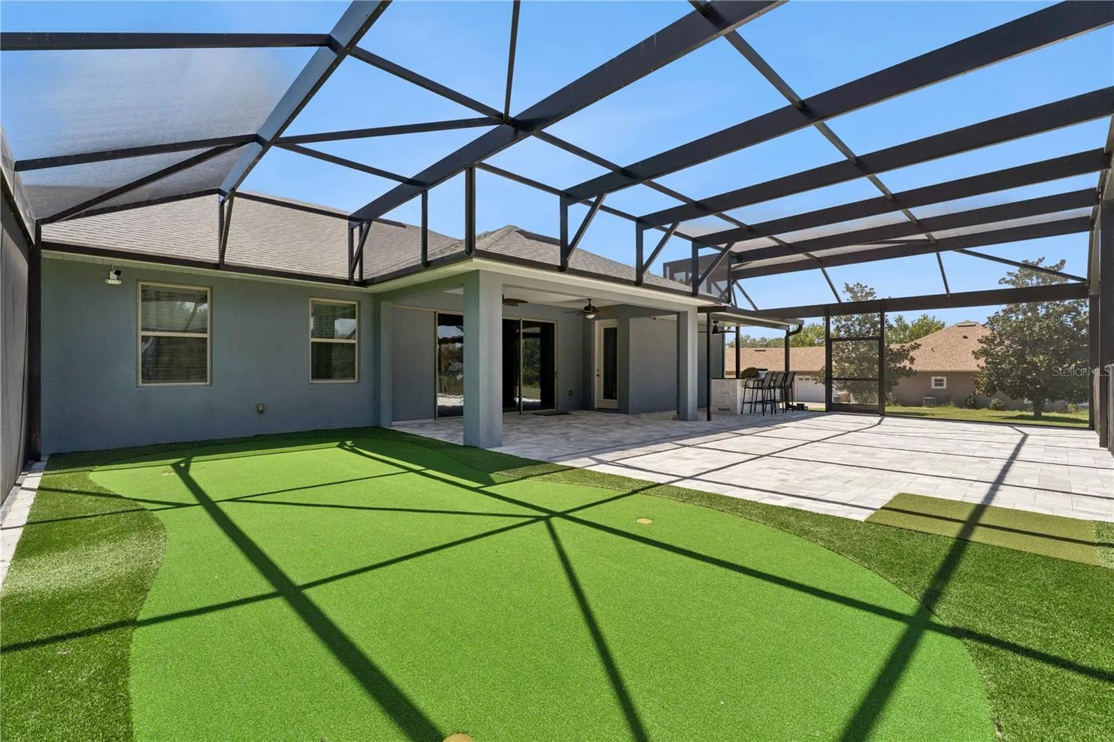 Putting green on pool patio