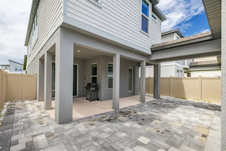 paved and fenced backyard