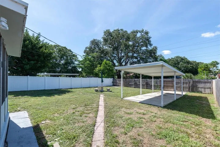 Covered concrete pad, perfect for a second car, a boat or a shaded outside area.