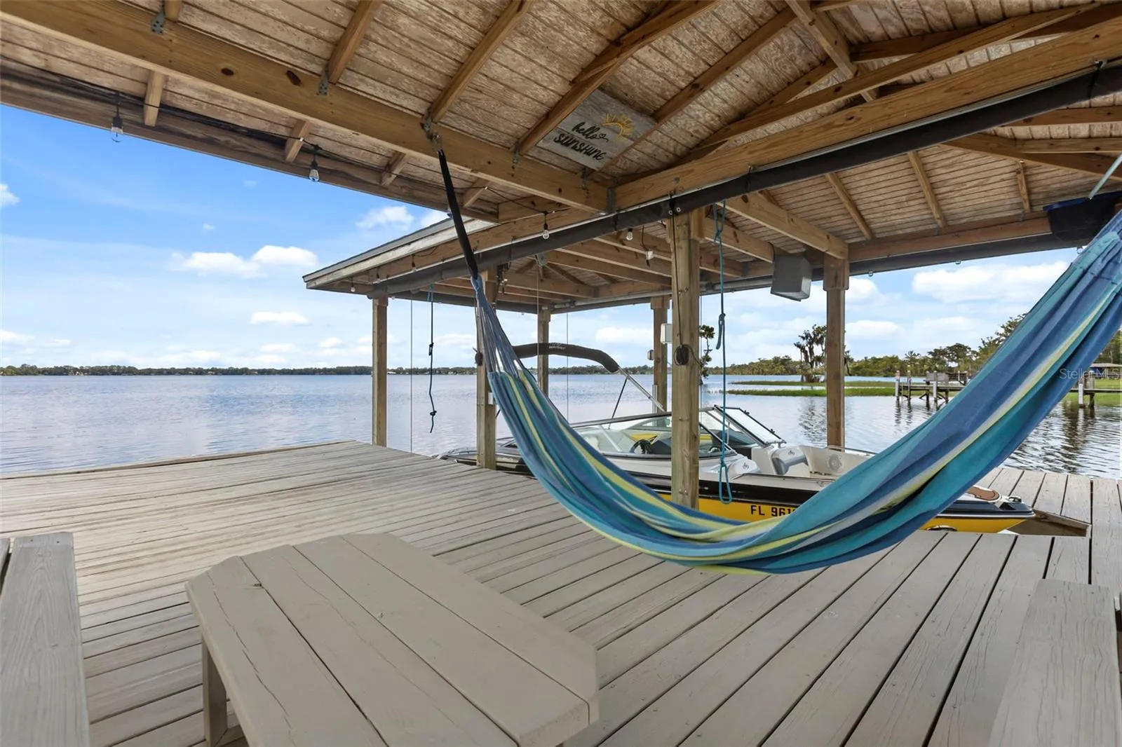 A private dock and boatlift provide immediate access to Lake Sheen and the entire Butler Chain, while a gated community boat ramp is approximately 300 feet away.