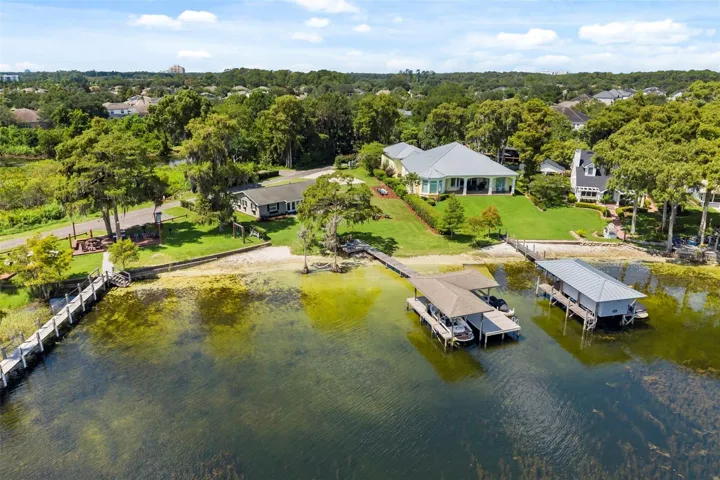 An exceptional opportunity to own one of the most compelling lakefront properties on Lake Cottage Lane, featuring an oversized homesite, expansive Lake Sheen views, sandy shoreline, private dock and boatlift, and an existing 2BR/1.5BA lake cottage that can be enjoyed today while you plan the lakefront estate of your dreams.